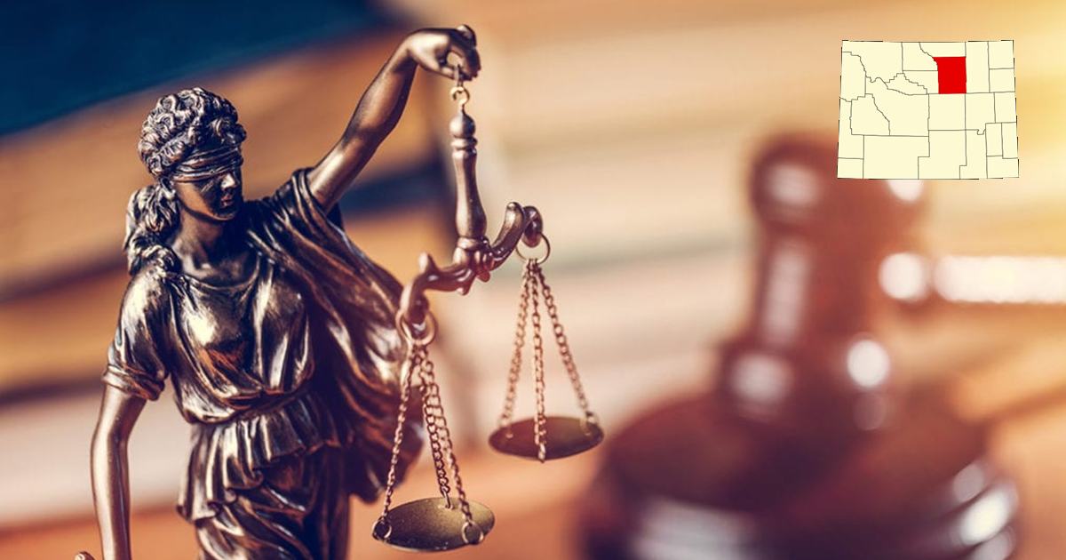 Picture of lady justice with map showing Johnson County Wyoming