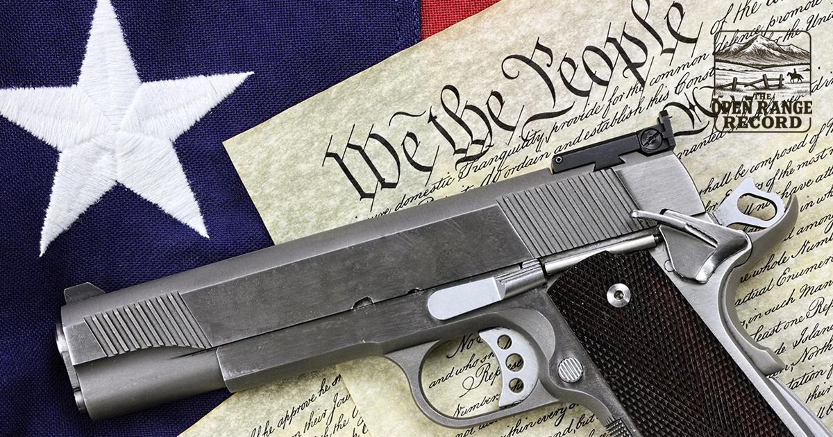 Picture of a pistol with the Constitution and Flag