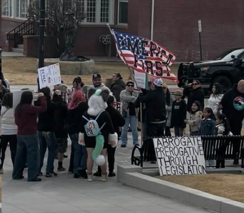 Man waving America First flag
