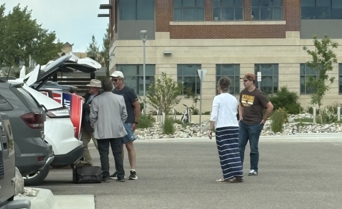 Rep Steve Harshman handing out signs at the Thyra State Building