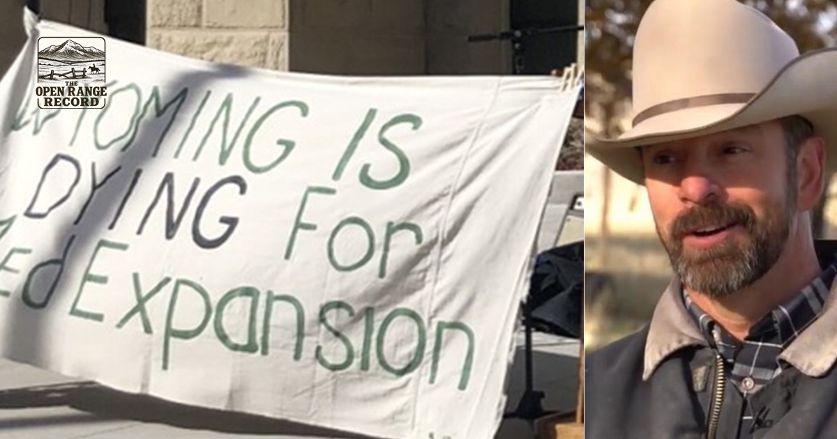 Eric Barlow and a medicaid expansion sign in front of the Wyoming Capitol
